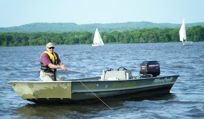 Committee Boat Weighs Anchor